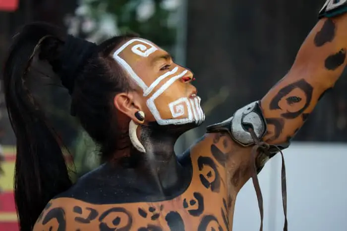 An actor portraying a Mayan "jaguar warrior" with jaguar spots and tribal war paint.  Jaguar spots were worn as jaguar tattoos by indigenous warriors in South America.