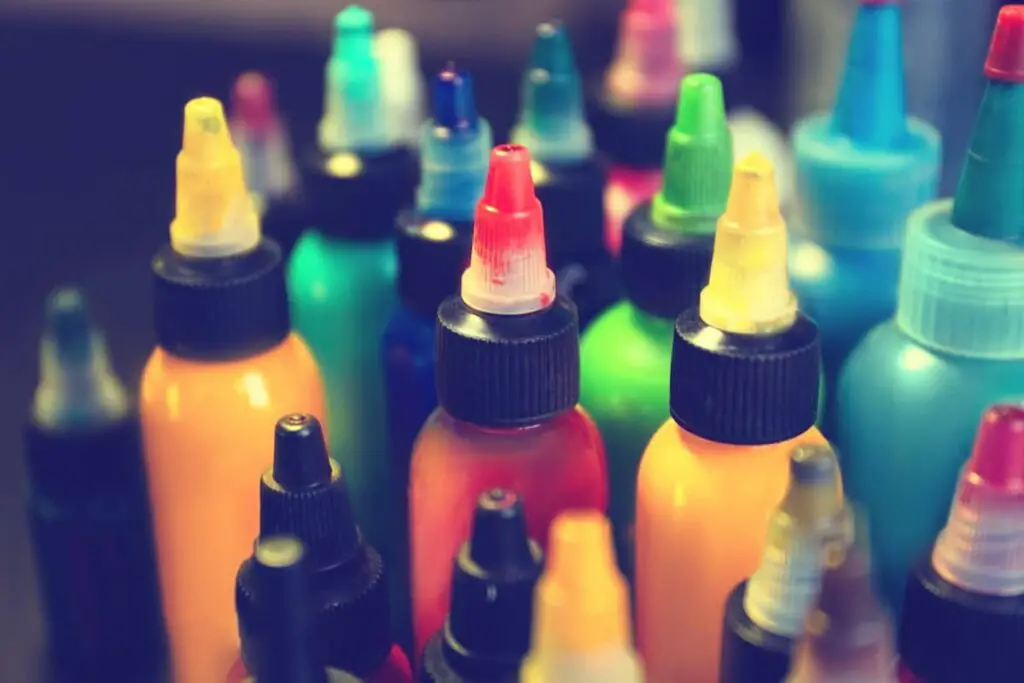 Closeup of bottles of tattoo ink colors.