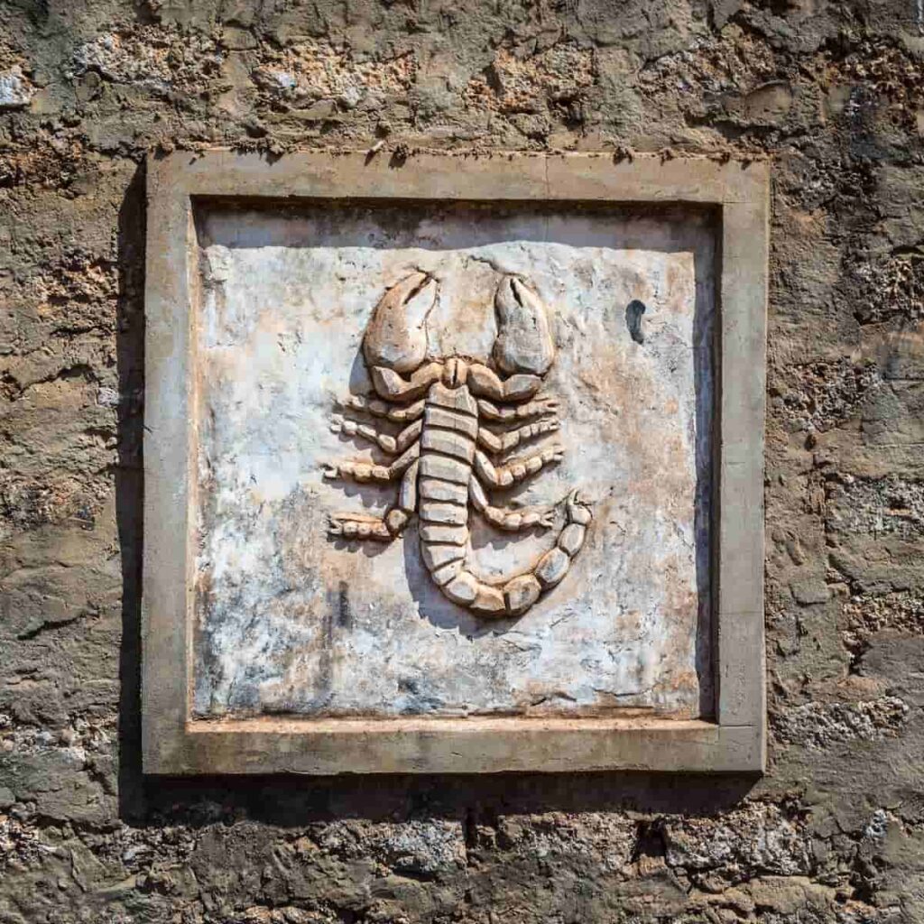 A stone carving of a scorpion.