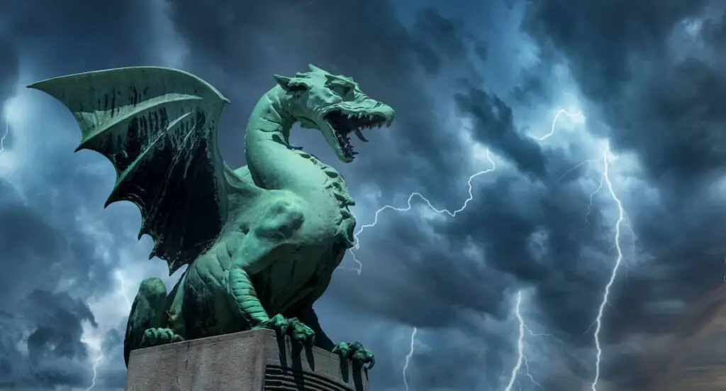 The Dragon Bridge in Ljubljana, Slovenia with a dragon statue against a sky during a thunderstorm.