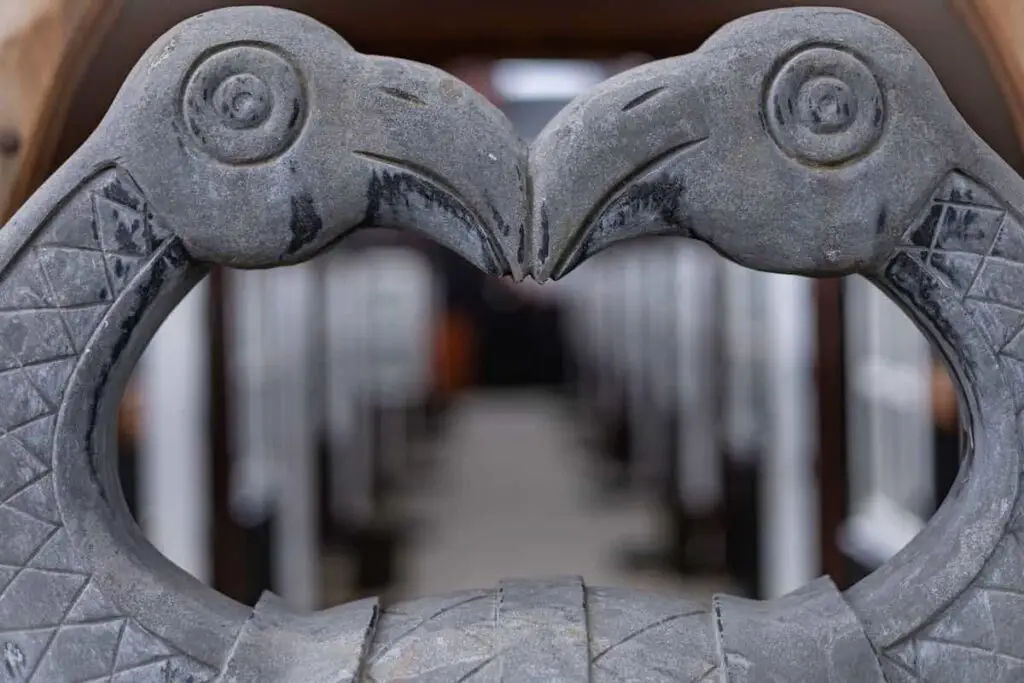 A carved statue of two ravens in Iceland that serves as a tribute to Odin.