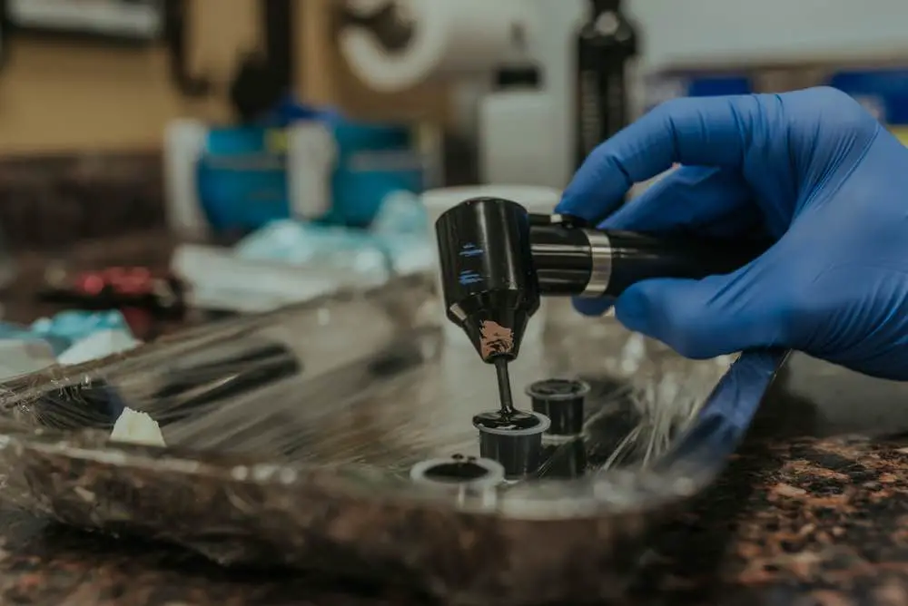 guy holding tattoo gun