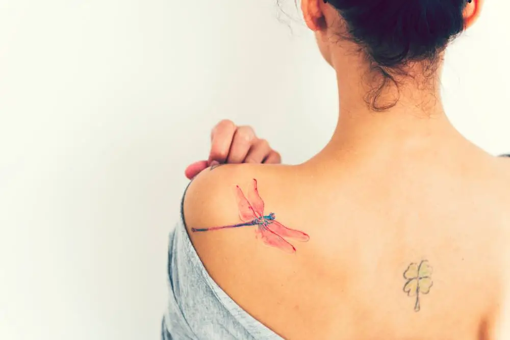 woman with a dragonfly tattoo